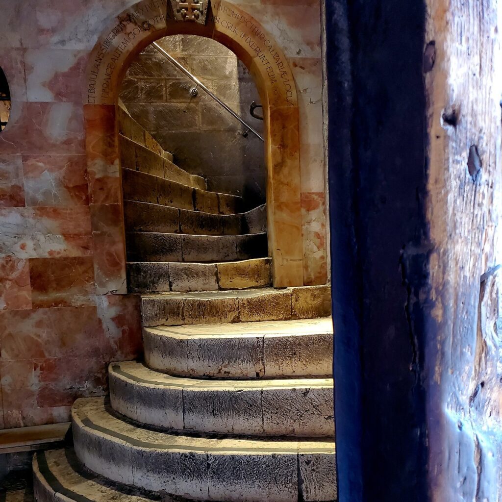 A staircase inside The Church of the Holy Sepulcher. The stone stairs worn by the feet of many.