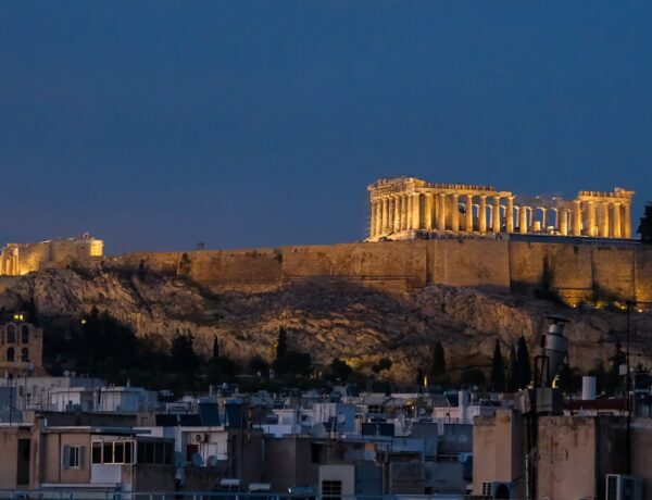 The Acropolis at night. Lit by lights between the columns.