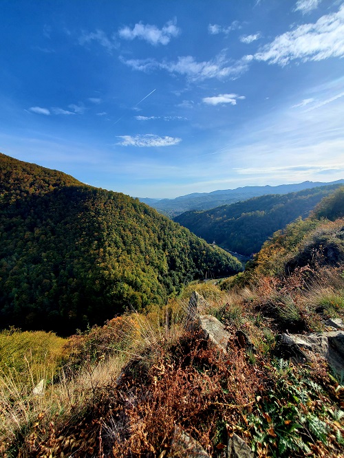 Overlook of the Transfăgărăşan in Romania. The hills and mountains are green with just the begining touch of fall in the leaves.