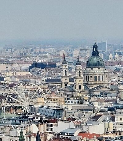 The baroque buildings and Ferris wheel in the old city of Budapest.