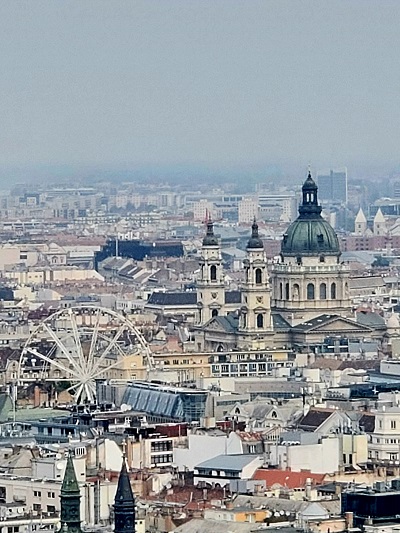 The baroque buildings and Ferris wheel in the old city of Budapest.