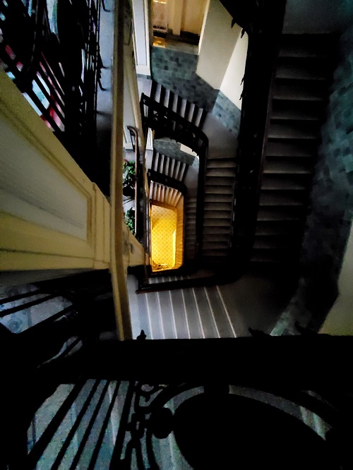 Staircases wrap around a central courtyard like an MC Esscher drawing. 